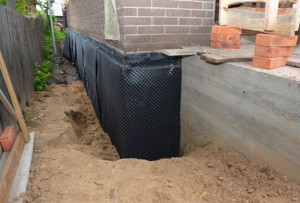 Happy homeowners after waterproofing job in Spencer